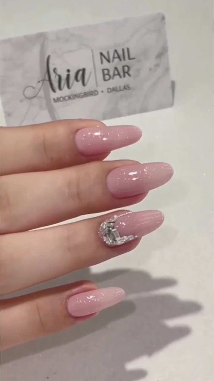 Pink sparkle manicure with crystal detail