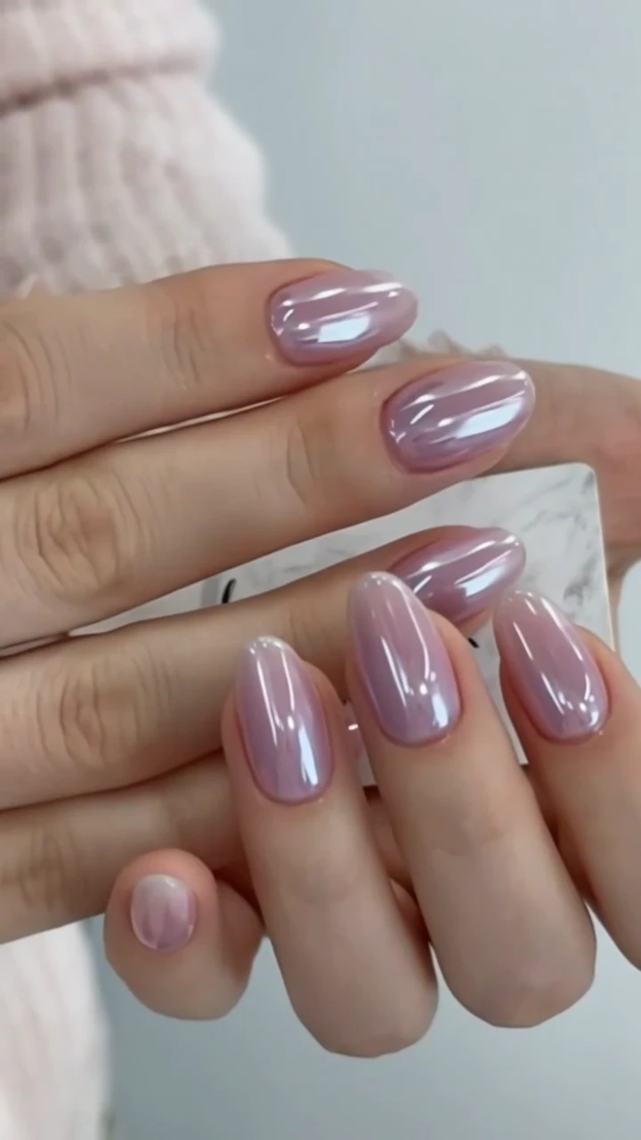 Luminous purple chrome manicure by Aria
